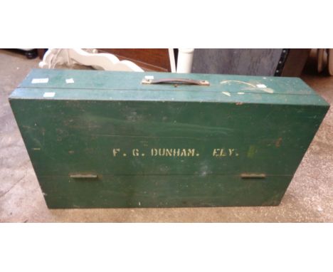 A wooden carpenter's tool box containing a quantity of old tools