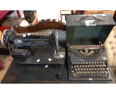 An antique cased Imperial 'Good Companion' typewriter - sold with an antique Singer sewing machine (no case or base)