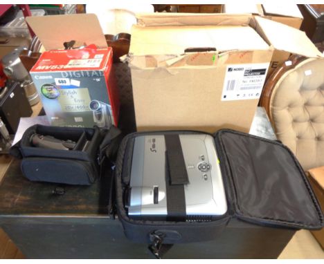 A boxed Cannon MV830I camcorder - sold with a boxed Nobo S16E projector