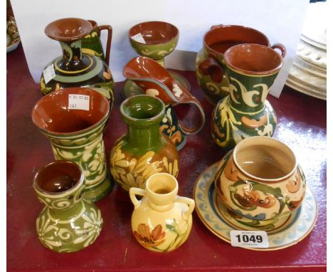 A quantity of Torquay pottery vases and jugs of various size and form - various makers including HM Exeter, Aller Vale, etc. 