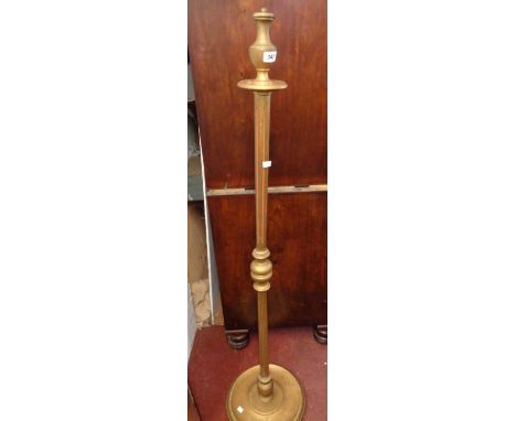 A giltwood standard lamp with red painted fluted lines to column, set on a circular base - for re-wiring and fitting