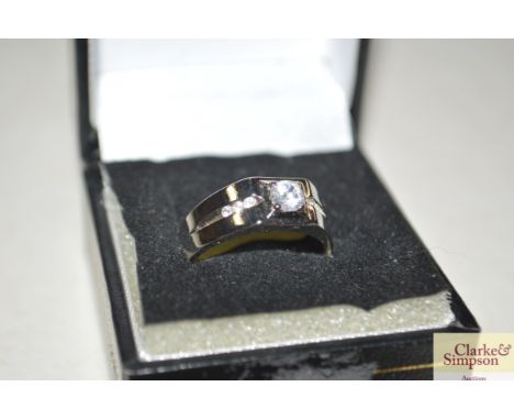 A boxed silver ring set with white stone