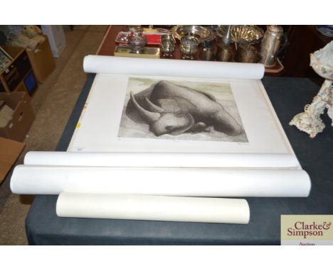 A pencil signed limited edition print of a Rhino and various unframed maps