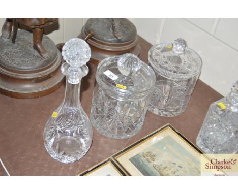 Two cut glass biscuit barrels; and a decanter and stopper 