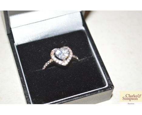 A boxed silver and heart shaped white stone set ring 