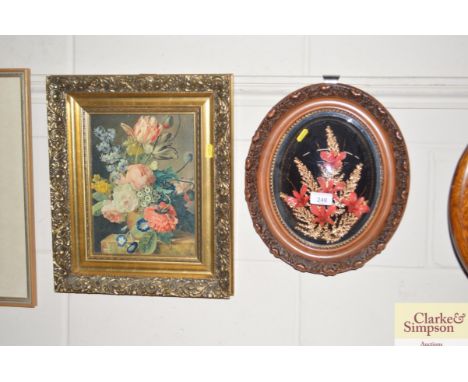 A floral collage in decorative convex frame; and a oleograph of a Dutch Old Master scene