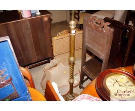A brass standard lamp and shade 