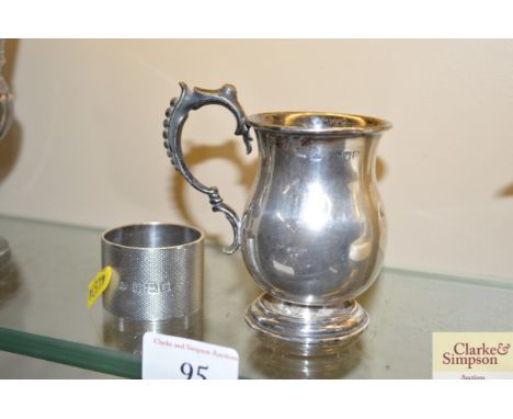 A silver baluster Christening mug and a heavy engine turned silver cigarette ring 