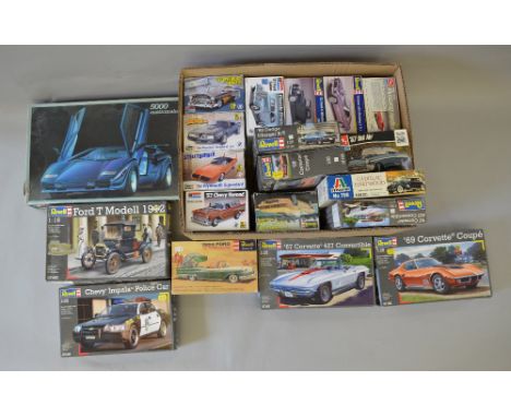 19 assorted car related model kits including Revell and Italieri examples, varying scales. Contents not checked.