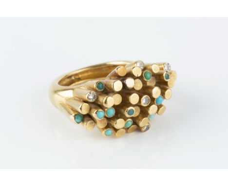 A TURQUOISE AND DIAMOND DRESS RING, modelled as an abstract tubular cluster of part-textured finish, highlighted by cabochon 