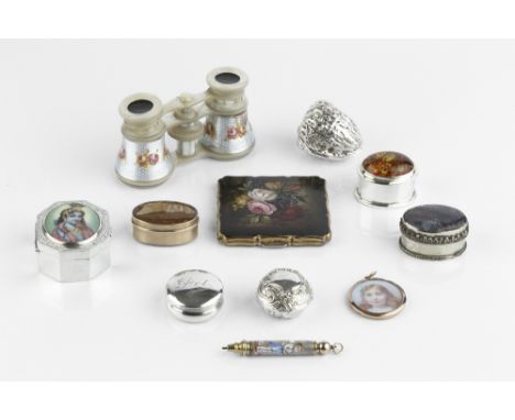 A LATE VICTORIAN SILVER CIRCULAR PILL BOX, repoussé decorated with scrolls, Birmingham 1900, 3cm; another silver pill box; a 