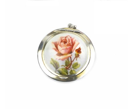 A SILVER AND ENAMEL SMALL HAND MIRROR, the white guilloche enamel ground painted with a spray of roses and forget-me-nots, by