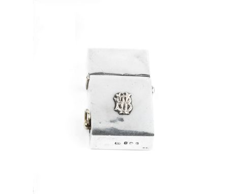 AN EDWARDIAN SILVER RECTANGULAR PETROL LIGHTER, with gilt applied monogram and jewelled catch, by Horton &amp; Allday, Birmin