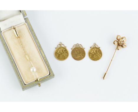 THREE HALF SOVEREIGN PENDANTS, each with fixed scrolled pendant mount, together with a diamond set flowerhead stick pin, cent