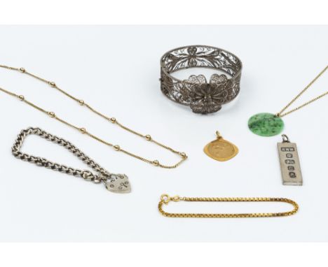 A COLLECTION OF JEWELLERY, comprising a jade panel pendant, with pierced and carved decoration, on a trace-link chain, a 9ct 