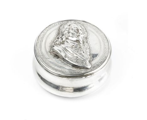AN ANTIQUE SILVER CIRCULAR BOX, the hinged cover with relief portrait of Charles I, within engraved border, the underside of 