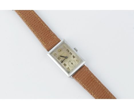 A GENTLEMAN'S WRISTWATCH, the rectangular silvered dial with Arabic numerals and subsidiary seconds dial, to a later jewelled