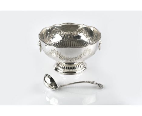 A QUANTITY OF SILVER PLATED ITEMS, to include a punch bowl, with lobed and embossed decoration, a Kings pattern ladle, a swin