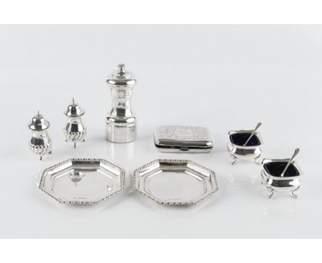 A SMALL COLLECTION OF SILVER, comprising a pair of octagonal small dishes, London 1933; a pepper grinder; a cigarette case; a