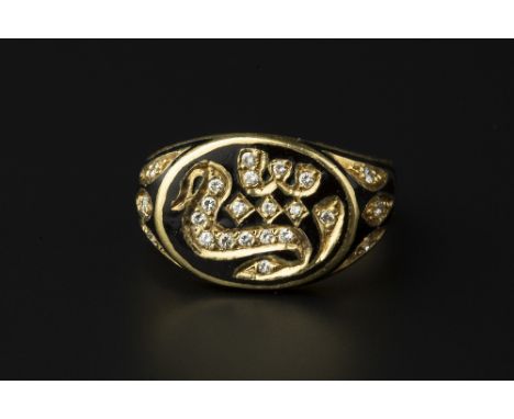 AN EASTERN ENAMEL AND DIAMOND DRESS RING, inset with round brilliant-cut diamonds to a black enamel ground, stamped '750', ri