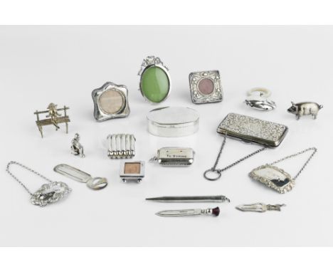 A COLLECTION OF SMALL SILVER ITEMS, to include an Edwardian Art Nouveau miniature photo frame, Birmingham 1903, 4.5cm, anothe