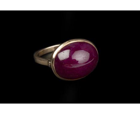 A RUBY SINGLE STONE RING, the oval cabochon ruby in collet setting, yellow precious metal mounted, stamped '18k', ring size a