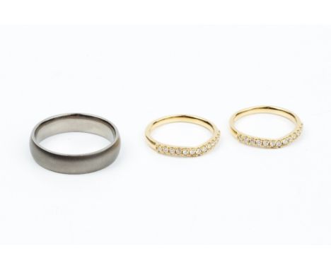A PAIR OF DIAMOND SET HALF HOOP RINGS, each with a wishbone-shaped channel of round brilliant-cut diamonds, 18ct gold mounted