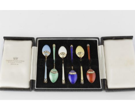A SET OF SIX SILVER GILT AND VARI-COLOURED ENAMEL COFFEE SPOONS, by Turner &amp; Simpson, Birmingham 1954, cased; and a set o