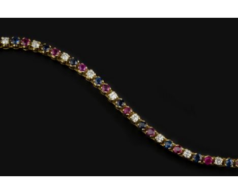 A RUBY, SAPPHIRE AND DIAMOND LINE BRACELET, designed as an articulated line of alternate circular mixed-cut rubies, sapphires