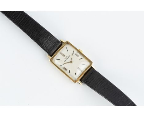 A LADY'S 18CT GOLD CASED WRISTWATCH BY INTERNATIONAL WATCH COMPANY, the rectangular silvered dial with baton markers, to a je