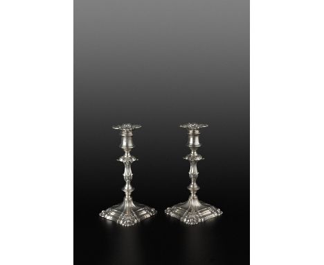 A PAIR OF MID-VICTORIAN SILVER CANDLESTICKS, with knopped baluster stems, the shaped square bases with scalloped corners, by 