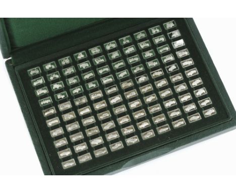 A SET OF MINIATURE SILVER INGOTS: the 100 Greatest Cars, boxed together with guide book and viewer, by John Pinches Ltd