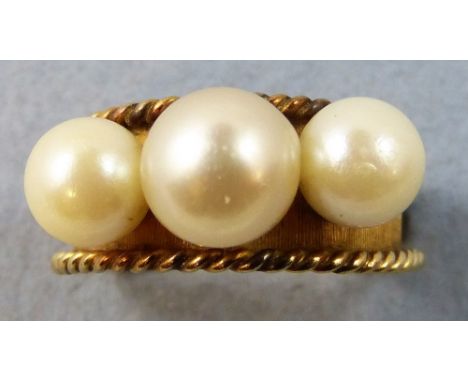 A 14 k gold and cultured pearl dress ring, peg set with three beads, size R 1/2, weight 6.5 gm.