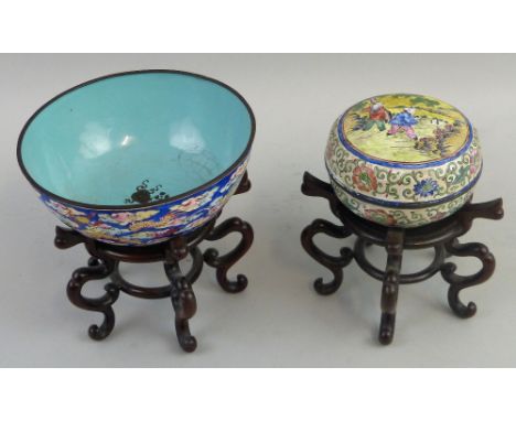 A Chinese Canton enamel bowl, of pedestal circular form, the outside painted with two four-clawed dragons chasing a flaming p