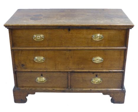 A George III oak mule chest, with moulded edged oblong hinged top, planked sides with exposed dovetails, the front with two d