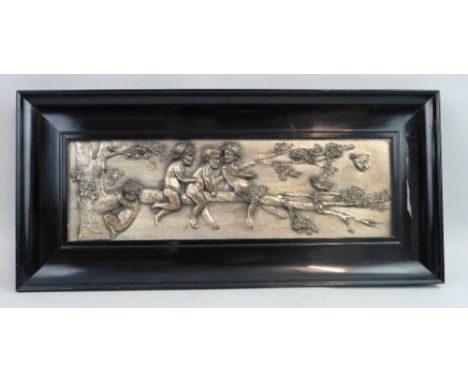 Helmuth Schievelkamp - an early 20th century plated metal oblong panel, embossed with four naked children playing on the bran