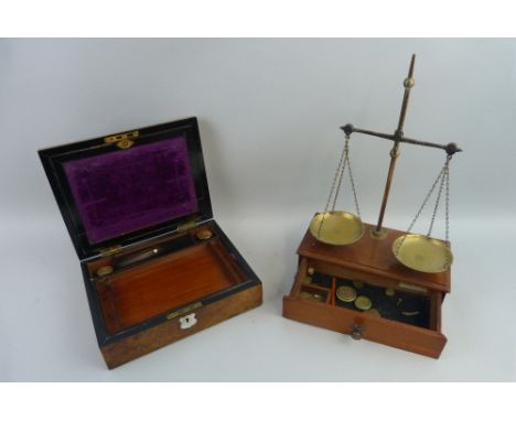 A Victorian burr walnut writing box, of oblong form, opening to reveal a fitted interior, 27cm wide, together with a set of V