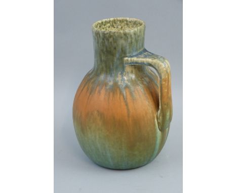 A Ruskin Pottery W. Howson Taylor single handled vase, of bulbous form with mottled matt glaze shading from grey through oran