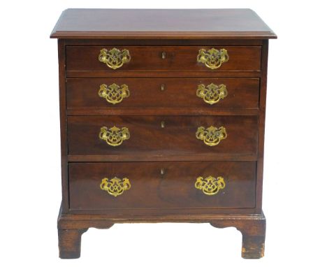 A George III style mahogany chest of four long graduated drawers, with moulded edge oblong top, pierced brass plate handles a