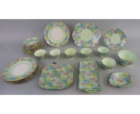 A Shelley part tea service in the "Melody" pattern, comprising eighteen plates in three graduated sizes, six cups and five sa