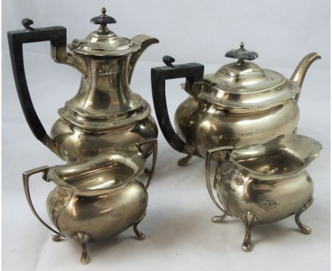 A silver four piece tea and coffee service, by Walker & Hall, Sheffield 1928, of oval baluster form, raised on four pad feet;