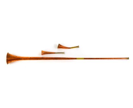 A Swaine &amp; Adeney hunting horn, a French hunting horn, and a coaching horn (3)