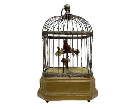 Late 19th/early 20th century birdcage automaton, the single bird adorned with bright red feathers seated upon T-bar perch wit