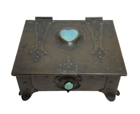 Arts and Crafts copper box, the lid decorated with stylised riveted hinges and inset with Ruskin type ceramic turquoise heart