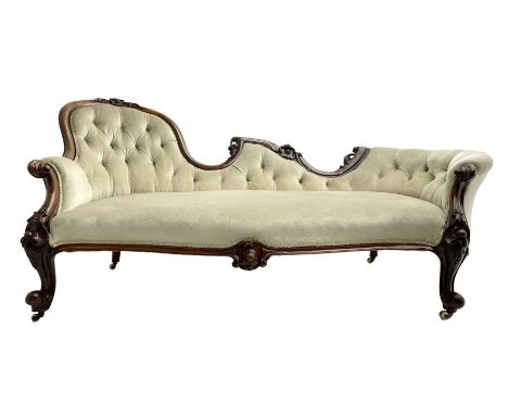 Victorian walnut chaise longue or settee, shaped back carved with cartouche motifs and foliage, upholstered in buttoned pale 