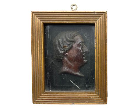19th century wax relief portrait, depicting the head of a gentleman facing dexter, contained within a reeded box frame, overa
