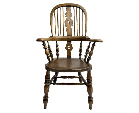 Early 19th century elm and ash Yorkshire Windsor armchair, high stick back with pierced and fretwork splat, turned supports j