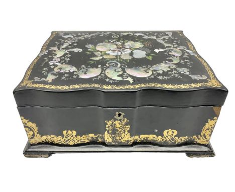 Victorian papier m�ch� box decorated throughout with gilt scrolls, the cover with hand painted floral spray surrounded with i