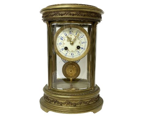 French late 19th-century 8-day oval four-glass mantle clock, oval brass case with reeded columns and continuously applied gad