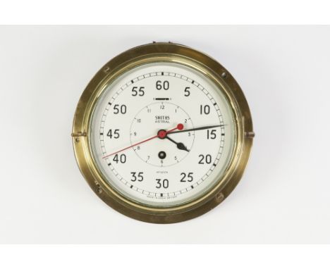 SMITHS 'ASTRAL' BRASS CASED BULKHEAD CLOCK, the 7 ¾" Arabic dial with red seconds sweep and subsidiary hour dial to the centr